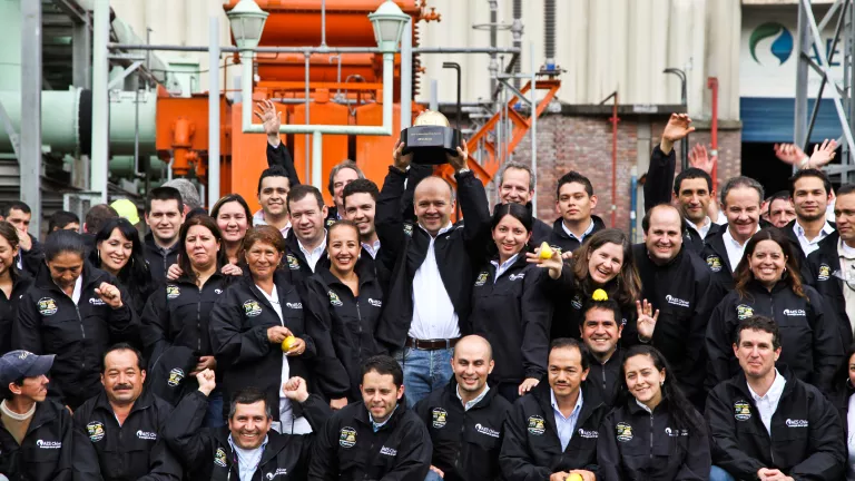 people holding golden hard hat award